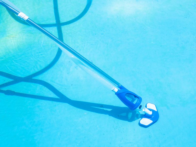 Vacuuming Pool Bottom